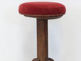 an image of a stool with a red cushion on it