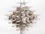 a large metal object that is hanging on a wall