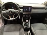 a picture of the interior of a car with a steering wheel and dashboard