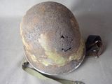 a helmet that has been left on the ground