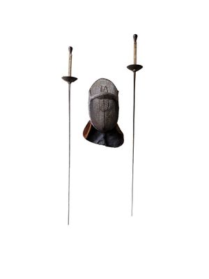 a statue of a man with a sword and a candle holder
