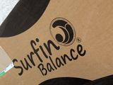 a brown box with a surfboard on top of it
