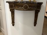a picture of a clock on a mantle in a room