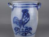 an image of a blue and white vase with a rooster on it