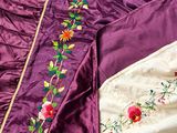 an image of a close up of a purple and white dress