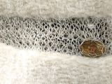a picture of a piece of fabric with a button on it