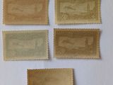 four different types of postage stamps on a white surface