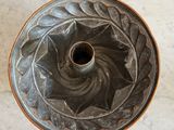 an overhead view of a cake pan sitting on a marble surface