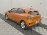 an orange car that is parked in a garage