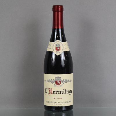 a bottle of wine that is sitting on a table