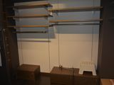 a closet with shelves and drawers in a room