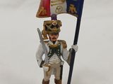 a figurine of a soldier holding a flag and a sword