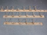 a lot of hooks on the wall that are attached to the wall
