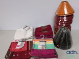 many different types of clothing on display on the table