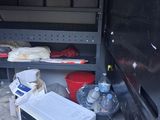 an image of a kitchen area with a microwave and other items