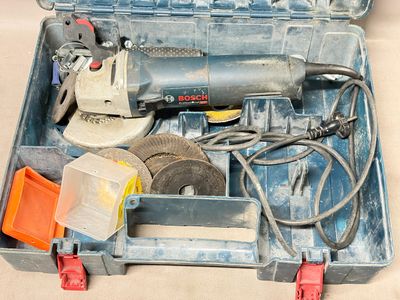 a tool box with tools inside of it on a table