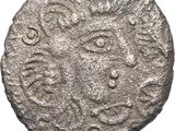 une pièce d'argent sur laquelle figure un motif