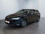 the toyota corollant is parked in a large room