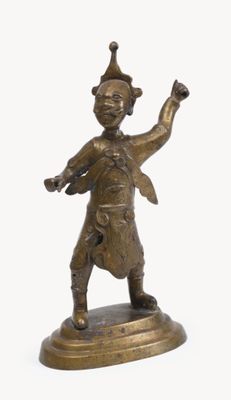 bronze figurine of a man with a hat on his head