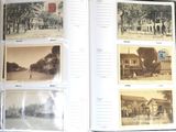a book opened to show pictures of a city