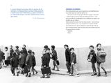 a black and white photo of a group of children walking down the street