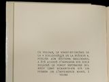 an open book with writing on it on a black background