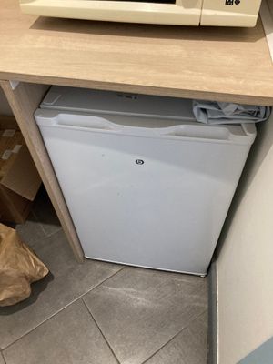 a microwave sitting on top of a counter next to a microwave oven