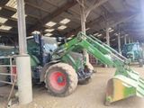 a tractor that is parked inside of a building