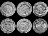 four different types of fingerprints on a black background
