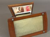 a small wooden box with a picture on it