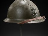 a helmet on a stand with a black background