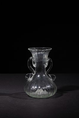 a glass vase that is sitting on a table