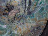 a close up of a glass vase with a clock on it