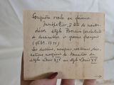 a person holding a piece of paper with writing on it