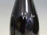 a bottle of wine that is sitting on a table