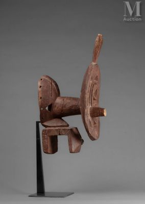 an image of a wooden sculpture of a horse on a stand