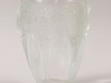 a glass vase that has a design on it