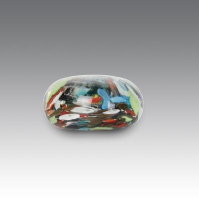 a close up of a glass object on a gray surface
