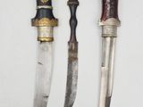 three different types of knives are displayed on a white surface
