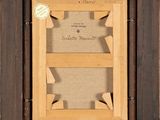 an old picture frame with a picture of a baseball player in it