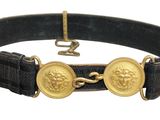 an image of a black belt with two gold medallions on it