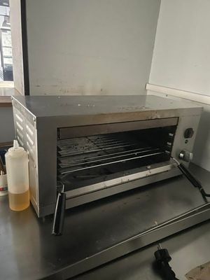 a toaster oven sitting on a counter in a kitchen