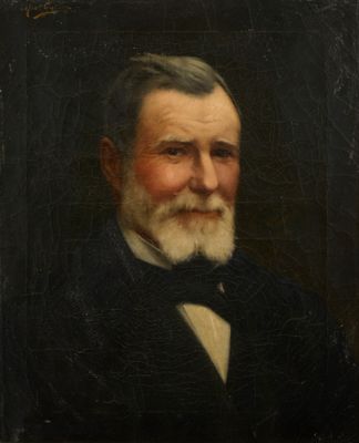 portrait of an old man with a white beard and a bow tie