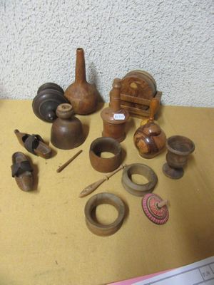 many different types of pottery sitting on a table