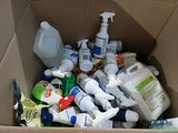 a cardboard box full of cleaning products and cleaning products