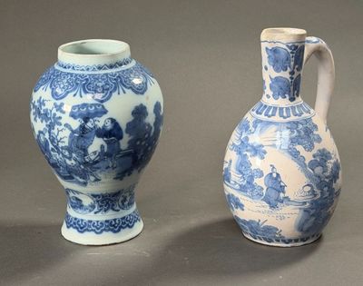 two blue and white vases sitting next to each other on a table