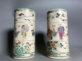 two vases that have been decorated with asian designs