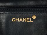 a chanel black leather shoulder bag with gold logo