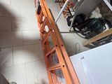 a ladder that is leaning against a wall in a garage