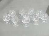 many empty wine glasses sitting on a table